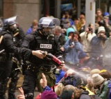 Police in riot gear doing crowd control